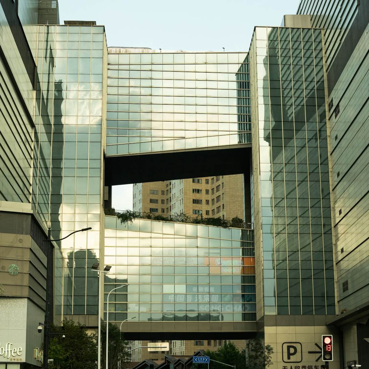 Modern glass buildings with a skybridge connecting them